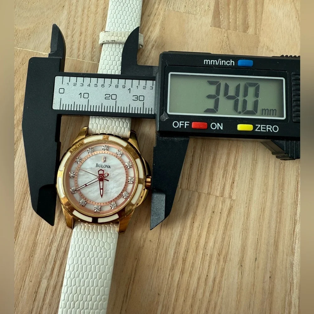 Bulova ladies 98P119 rose gold tone white leather watch NEW BATTERY